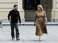 Ukrainian President Volodymyr Zelenskiy and Latvia's Prime Minister Evika Silina arrive for a joint press conference in Kyiv, Ukraine, on Se...