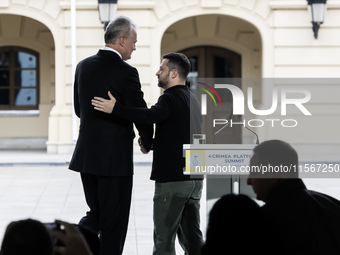 Lithuania's President Gitanas Nauseda shakes hands with Ukrainian President Volodymyr Zelenskiy after a joint press conference in Kyiv, Ukra...