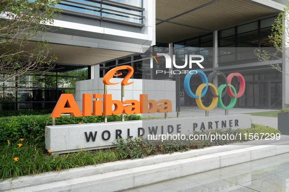 The Alibaba logo and the Olympic Rings are seen at the entrance of the Alibaba Campus on the West Bank of Xuhui in Shanghai, China, on Septe...