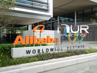 The Alibaba logo and the Olympic Rings are seen at the entrance of the Alibaba Campus on the West Bank of Xuhui in Shanghai, China, on Septe...