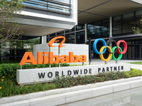 The Alibaba logo and the Olympic Rings are seen at the entrance of the Alibaba Campus on the West Bank of Xuhui in Shanghai, China, on Septe...