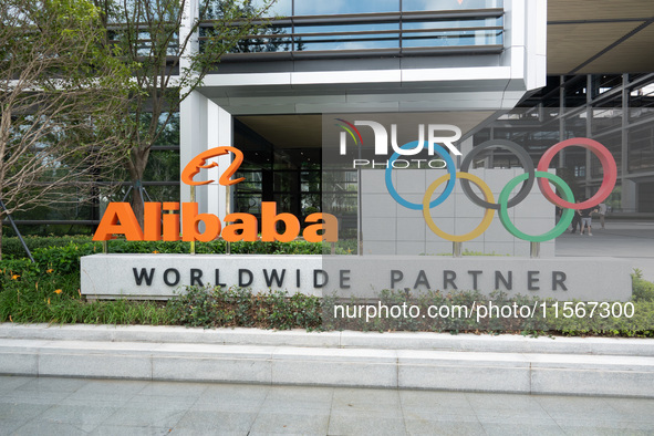 The Alibaba logo and the Olympic Rings are seen at the entrance of the Alibaba Campus on the West Bank of Xuhui in Shanghai, China, on Septe...