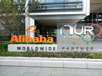 The Alibaba logo and the Olympic Rings are seen at the entrance of the Alibaba Campus on the West Bank of Xuhui in Shanghai, China, on Septe...