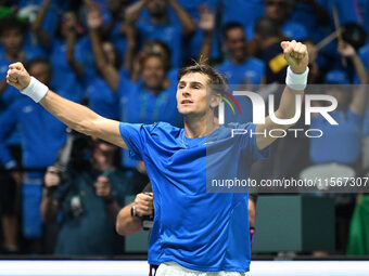 Matteo Arnaldi (ITA) is in action during the 2024 Davis Cup Finals Group Stage Bologna match between Italy and Brazil at Unipol Arena in Bol...