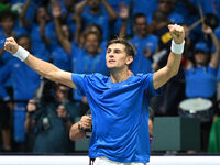 Matteo Arnaldi (ITA) is in action during the 2024 Davis Cup Finals Group Stage Bologna match between Italy and Brazil at Unipol Arena in Bol...