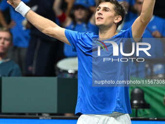 Matteo Arnaldi (ITA) is in action during the 2024 Davis Cup Finals Group Stage Bologna match between Italy and Brazil at Unipol Arena in Bol...