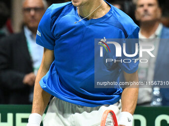 Matteo Arnaldi (ITA) is in action during the 2024 Davis Cup Finals Group Stage Bologna match between Italy and Brazil at Unipol Arena in Bol...