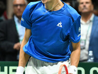 Matteo Arnaldi (ITA) is in action during the 2024 Davis Cup Finals Group Stage Bologna match between Italy and Brazil at Unipol Arena in Bol...