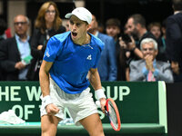 Matteo Arnaldi (ITA) is in action during the 2024 Davis Cup Finals Group Stage Bologna match between Italy and Brazil at Unipol Arena in Bol...