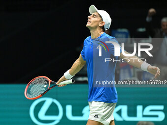 Matteo Arnaldi (ITA) is in action during the 2024 Davis Cup Finals Group Stage Bologna match between Italy and Brazil at Unipol Arena in Bol...