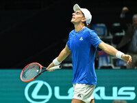 Matteo Arnaldi (ITA) is in action during the 2024 Davis Cup Finals Group Stage Bologna match between Italy and Brazil at Unipol Arena in Bol...