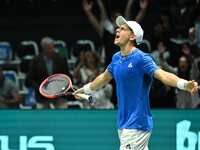 Matteo Arnaldi (ITA) is in action during the 2024 Davis Cup Finals Group Stage Bologna match between Italy and Brazil at Unipol Arena in Bol...