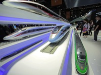 Visitors learn about China's high-speed rail technology at the booth of China Academy of Railway Sciences at the 2024 China Beijing Internat...