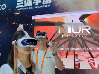 Visitors experience a VR game at the 2024 China Beijing International Fair for Trade in Services (CIFTIS) in Beijing, China, on September 12...