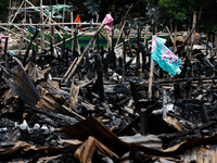 A towel hangs atop the rubble of damaged houses following a huge fire that engulfs at least 800 houses in Bacoor, Cavite, the Philippines, o...