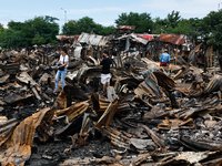 People look for salvageable items among the rubble of damaged houses following a huge fire that engulfs at least 800 houses in Bacoor, Cavit...