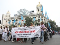 Members of the All Bengal Teachers Association, a teacher's movement in the Indian state of West Bengal, shout slogans during a protest rall...