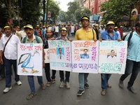 Members of the All Bengal Teachers Association, a teacher's movement in the Indian state of West Bengal, shout slogans during a protest rall...