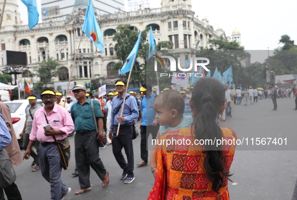 Members of the All Bengal Teachers Association, a teacher's movement in the Indian state of West Bengal, shout slogans during a protest rall...