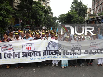 Members of the All Bengal Teachers Association, a teacher's movement in the Indian state of West Bengal, shout slogans during a protest rall...