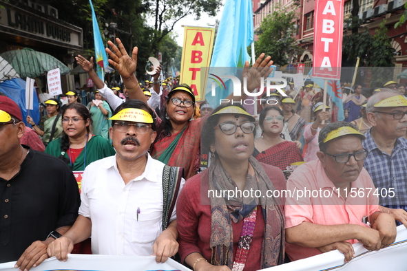 Members of the All Bengal Teachers Association, a teacher's movement in the Indian state of West Bengal, shout slogans during a protest rall...