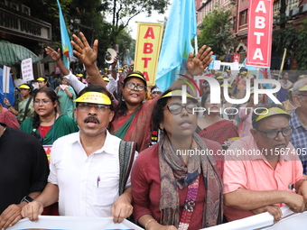 Members of the All Bengal Teachers Association, a teacher's movement in the Indian state of West Bengal, shout slogans during a protest rall...