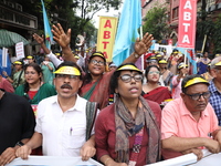 Members of the All Bengal Teachers Association, a teacher's movement in the Indian state of West Bengal, shout slogans during a protest rall...