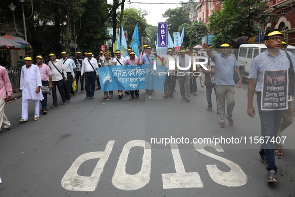 Members of the All Bengal Teachers Association, a teacher's movement in the Indian state of West Bengal, shout slogans during a protest rall...