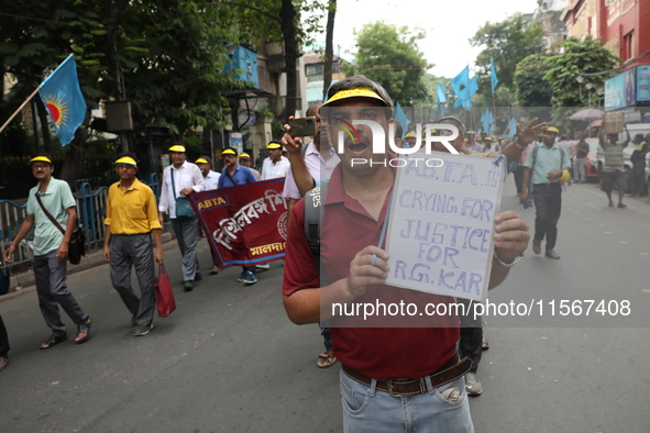 Members of the All Bengal Teachers Association, a teacher's movement in the Indian state of West Bengal, shout slogans during a protest rall...