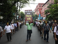 Members of the All Bengal Teachers Association, a teacher's movement in the Indian state of West Bengal, shout slogans during a protest rall...