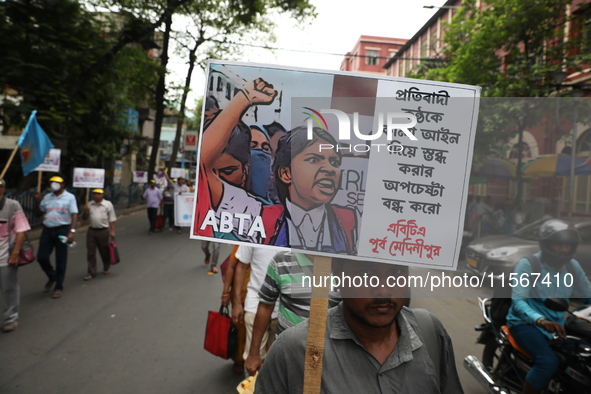 Members of the All Bengal Teachers Association, a teacher's movement in the Indian state of West Bengal, shout slogans during a protest rall...