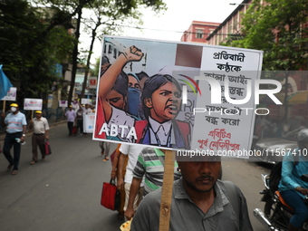 Members of the All Bengal Teachers Association, a teacher's movement in the Indian state of West Bengal, shout slogans during a protest rall...