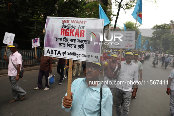 Members of the All Bengal Teachers Association, a teacher's movement in the Indian state of West Bengal, shout slogans during a protest rall...