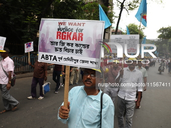 Members of the All Bengal Teachers Association, a teacher's movement in the Indian state of West Bengal, shout slogans during a protest rall...