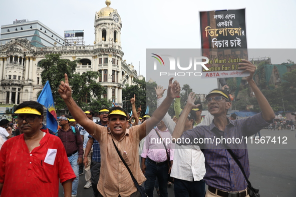 Members of the All Bengal Teachers Association, a teacher's movement in the Indian state of West Bengal, shout slogans during a protest rall...