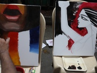 Artists paint on canvas to protest an art camp at Roar Side during a protest against the rape and murder of a PGT woman doctor at the govern...