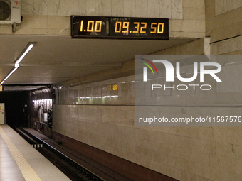 A digital clock is at the Demiivska metro station after the traffic launches following nine months of repairs in the tunnel between Demiivsk...