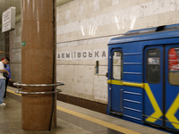 A train arrives at the Demiivska metro station after the traffic launches following nine months of repairs in the tunnel between Demiivska a...