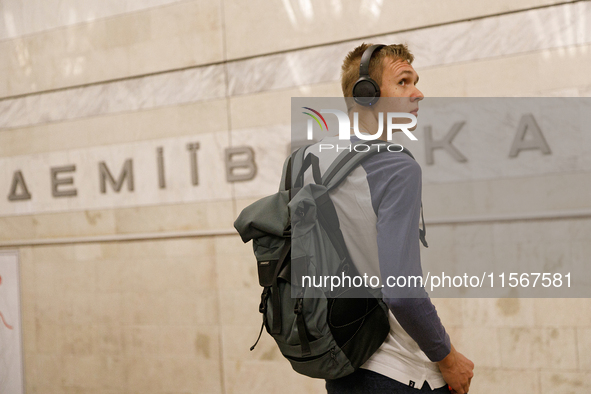 A passenger is at the Demiivska metro station after the traffic launches following nine months of repairs in the tunnel between Demiivska an...