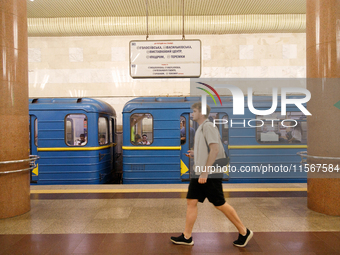 A passenger is at the Demiivska metro station after the traffic launches following nine months of repairs in the tunnel between Demiivska an...