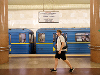 A passenger is at the Demiivska metro station after the traffic launches following nine months of repairs in the tunnel between Demiivska an...