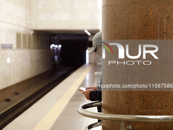 A passenger is at the Demiivska metro station after the traffic launches following nine months of repairs in the tunnel between Demiivska an...