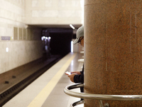 A passenger is at the Demiivska metro station after the traffic launches following nine months of repairs in the tunnel between Demiivska an...