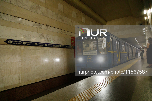 A train arrives at the Demiivska metro station after the traffic launches following nine months of repairs in the tunnel between Demiivska a...