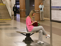 A passenger is at the Demiivska metro station after the traffic launches following nine months of repairs in the tunnel between Demiivska an...