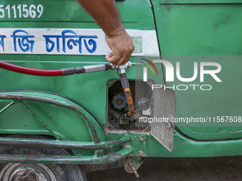 Vehicles queue to get fuel near a gas station during an acute gas shortage in Dhaka, Bangladesh, on September 12, 2024. (