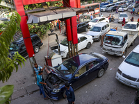 Vehicles queue to get fuel near a gas station during an acute gas shortage in Dhaka, Bangladesh, on September 12, 2024. (