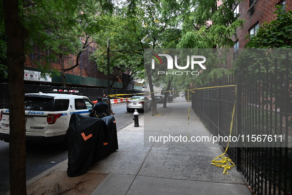 Crime scene tape is at the scene. A man is shot in the back multiple times in Manhattan, New York, United States, on September 12, 2024. At...