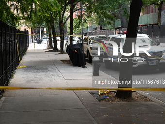 Crime scene tape blocks the area. A man is shot in the back multiple times in Manhattan, New York, United States, on September 12, 2024. At...