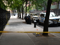 Crime scene tape blocks the area. A man is shot in the back multiple times in Manhattan, New York, United States, on September 12, 2024. At...